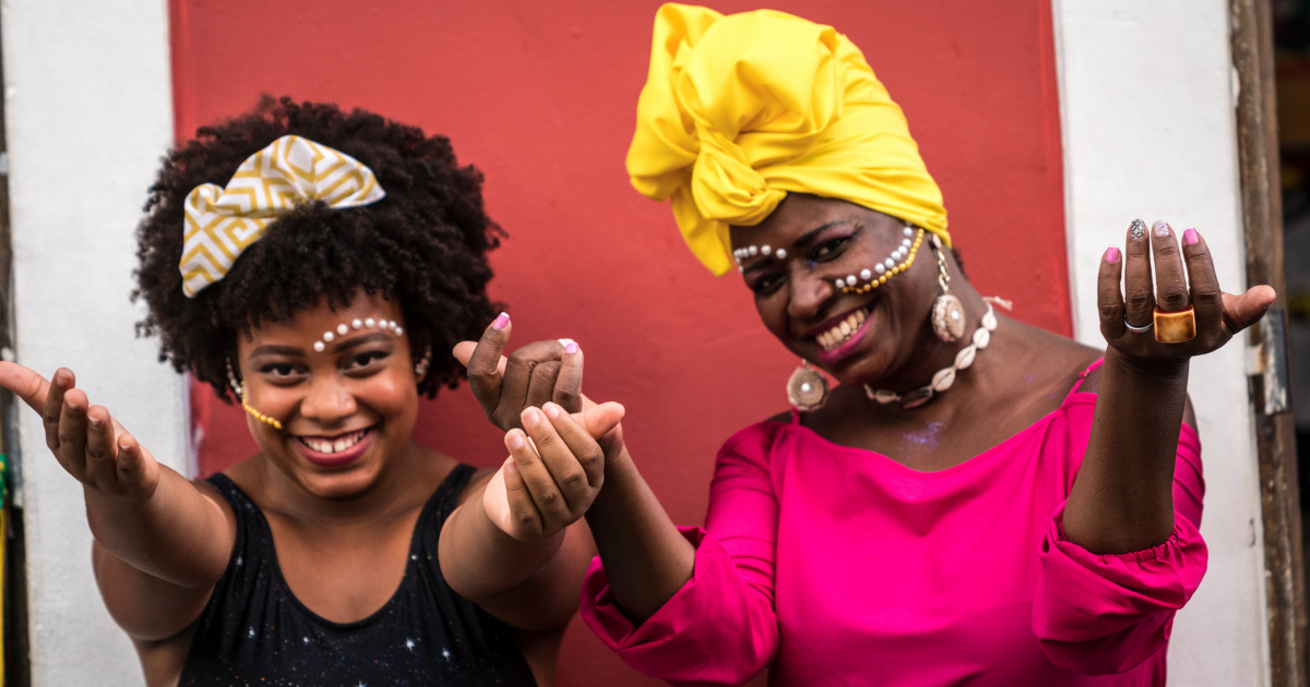 Two Afro-Latinx women celebrating