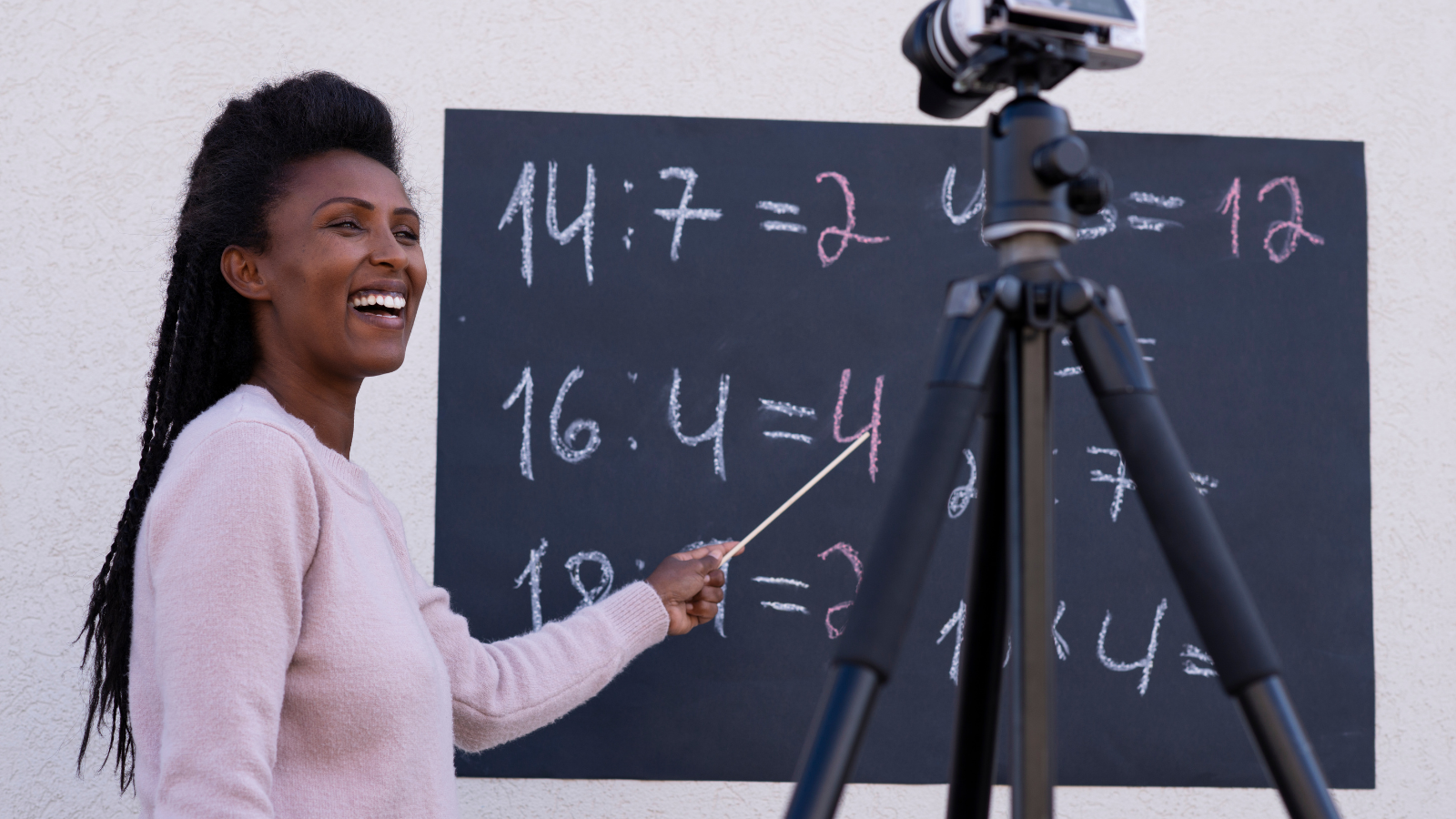 Image of a Black woman teaching virtually