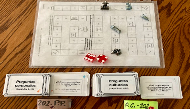 A board game with player pieces and die 