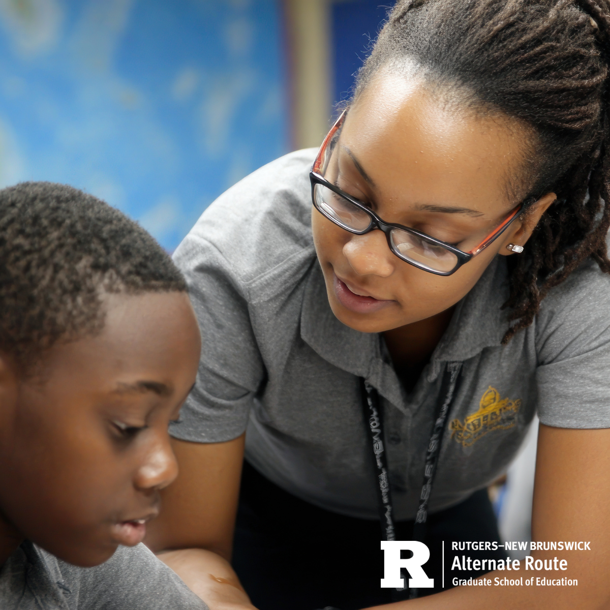 Teacher assistant giving one-on-one support to a student