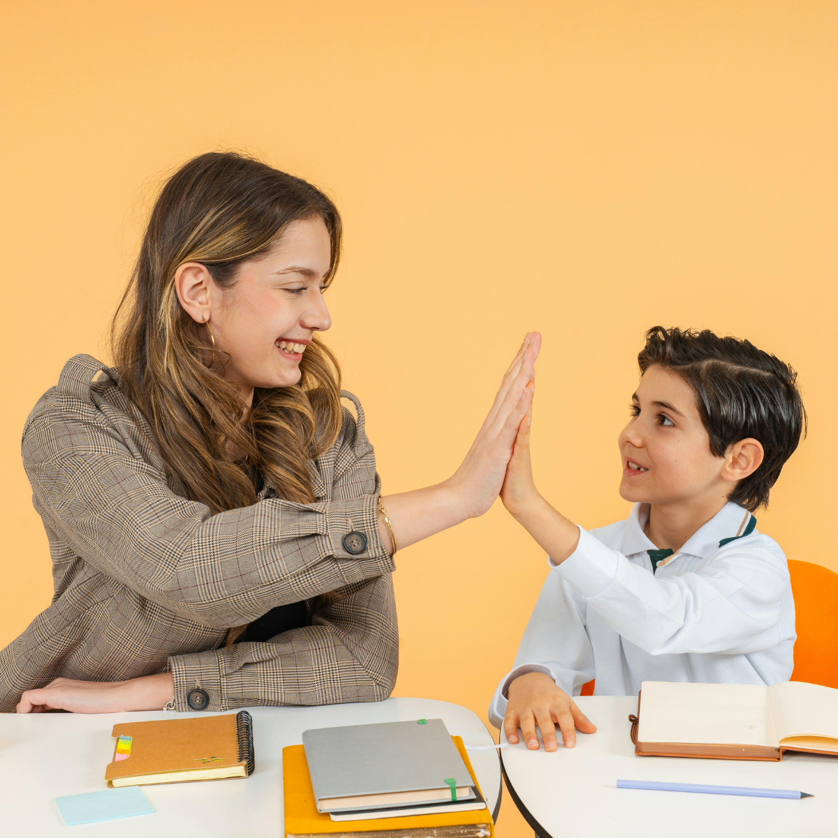 Teacher giving a high five to a student