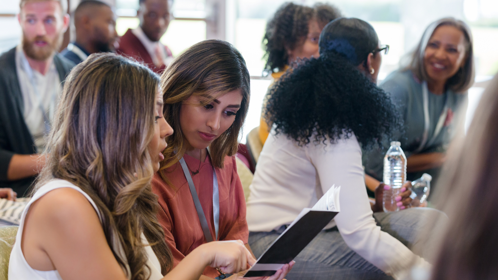 Group of young professionals sitting down at a conference