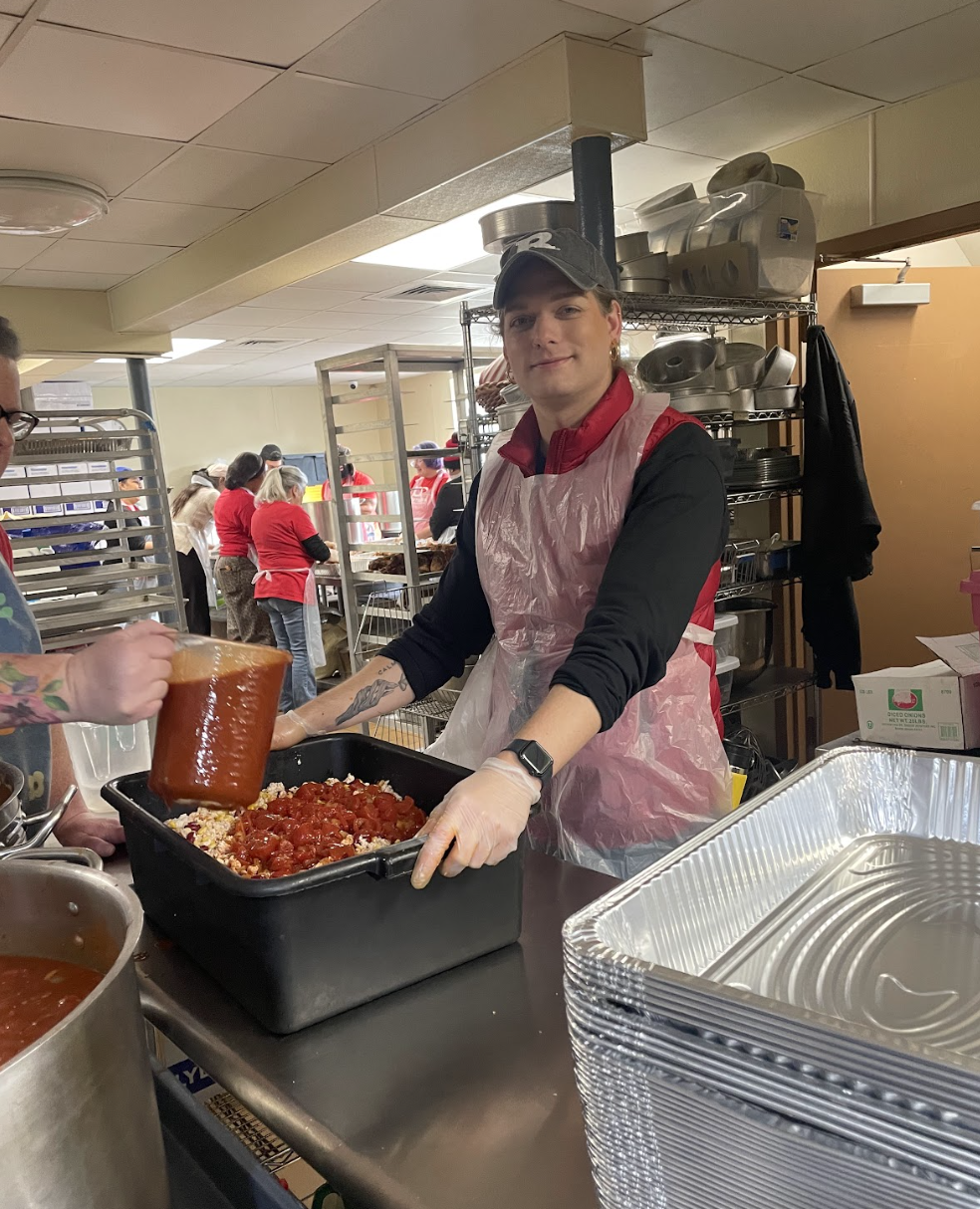 Tyler volunteering at Elijah's Promise s part of GSE's Sunshine Committee