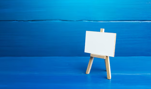 Canvas on an easel with a blue background