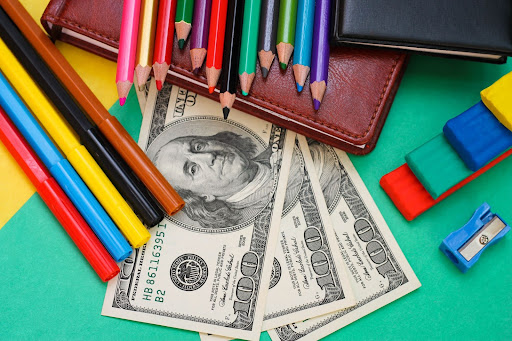 colored pencils, money and journals
