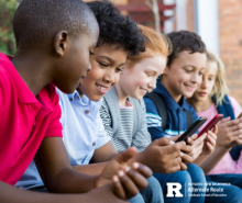 Group of diverse children using smartphones