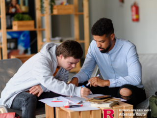A special education teacher working on an assignment with a student