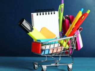 Mini shopping cart filled with school supplies