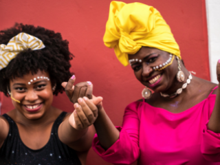 Two Afro-Latinx women celebrating