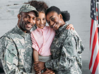 Male and female service members with child