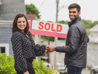 Woman and man who just made a home purchase