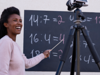 Image of Black woman teaching a class virtually