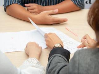 Two people sitting across a table